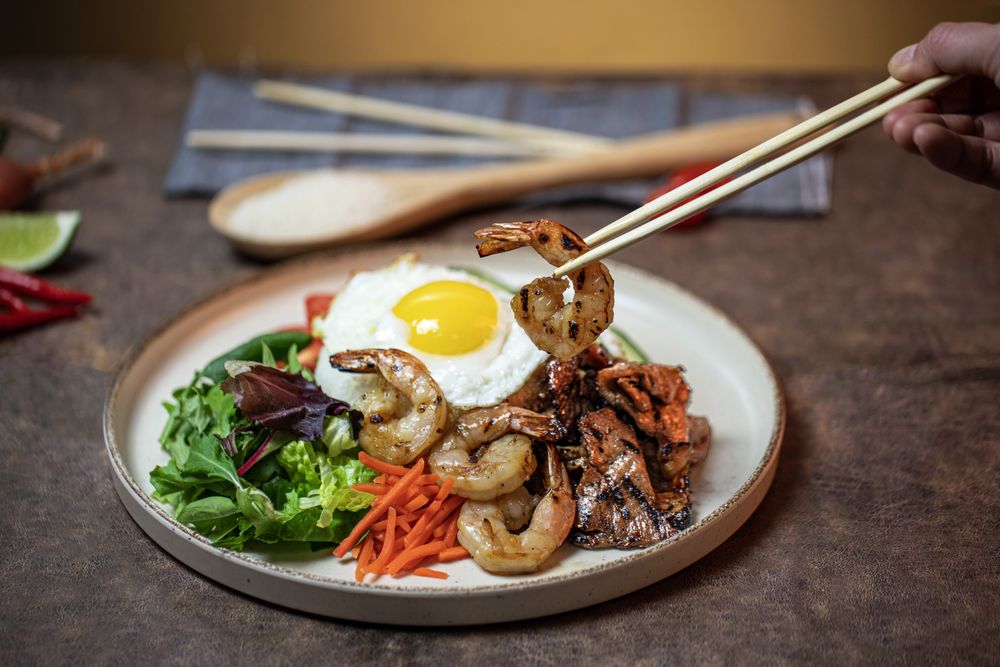 Grilled pork, shrimp, and fried egg broken rice plate